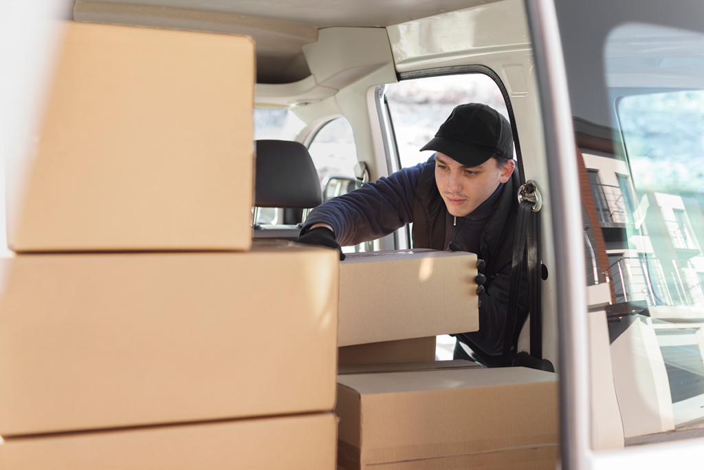 Professional movers loading furniture into a moving truck