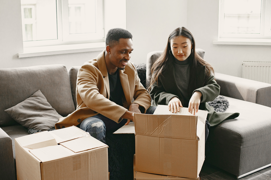 A couple discussing their moving plan with a consultant from Canadian Preferred Moving Company.