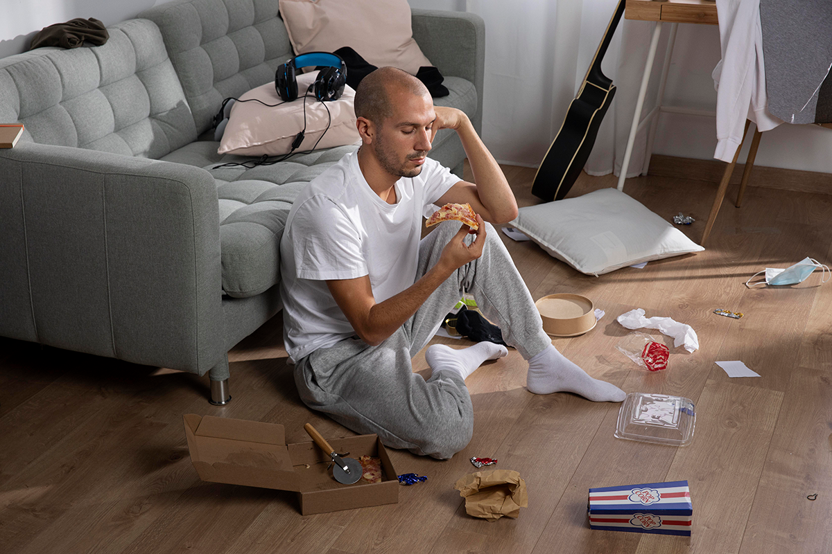 Person looking overwhelmed and disorganized with moving boxes