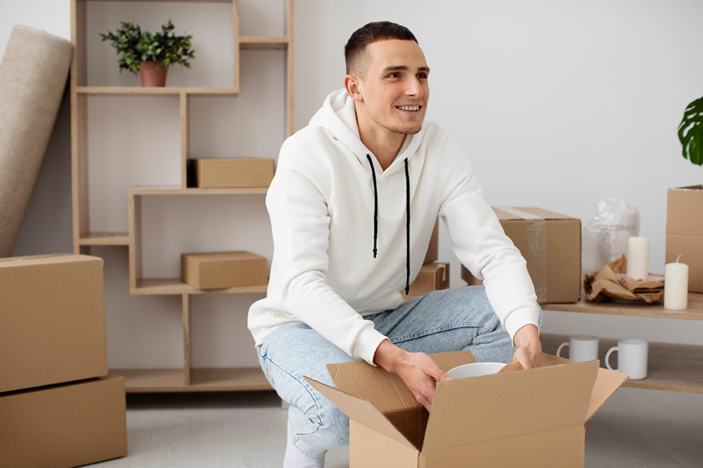 Professional packer organizing and wrapping fragile items