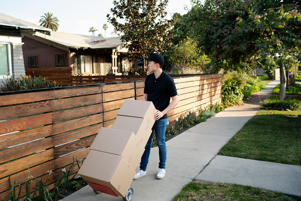 Person decluttering and sorting items before a long-distance move