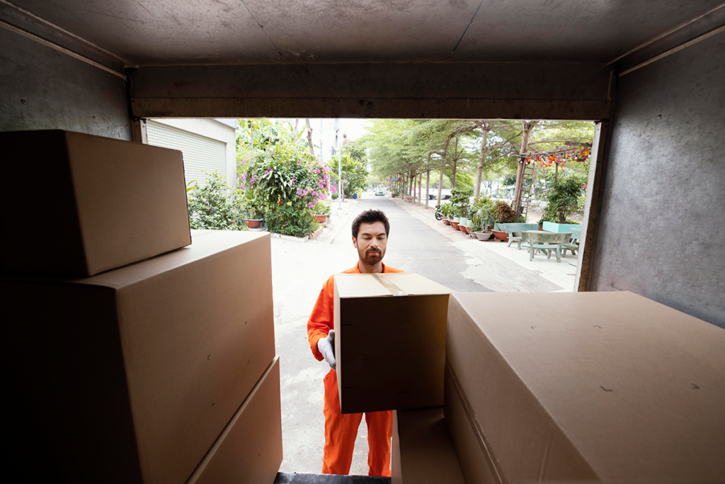 Moving boxes stacked neatly in a truck