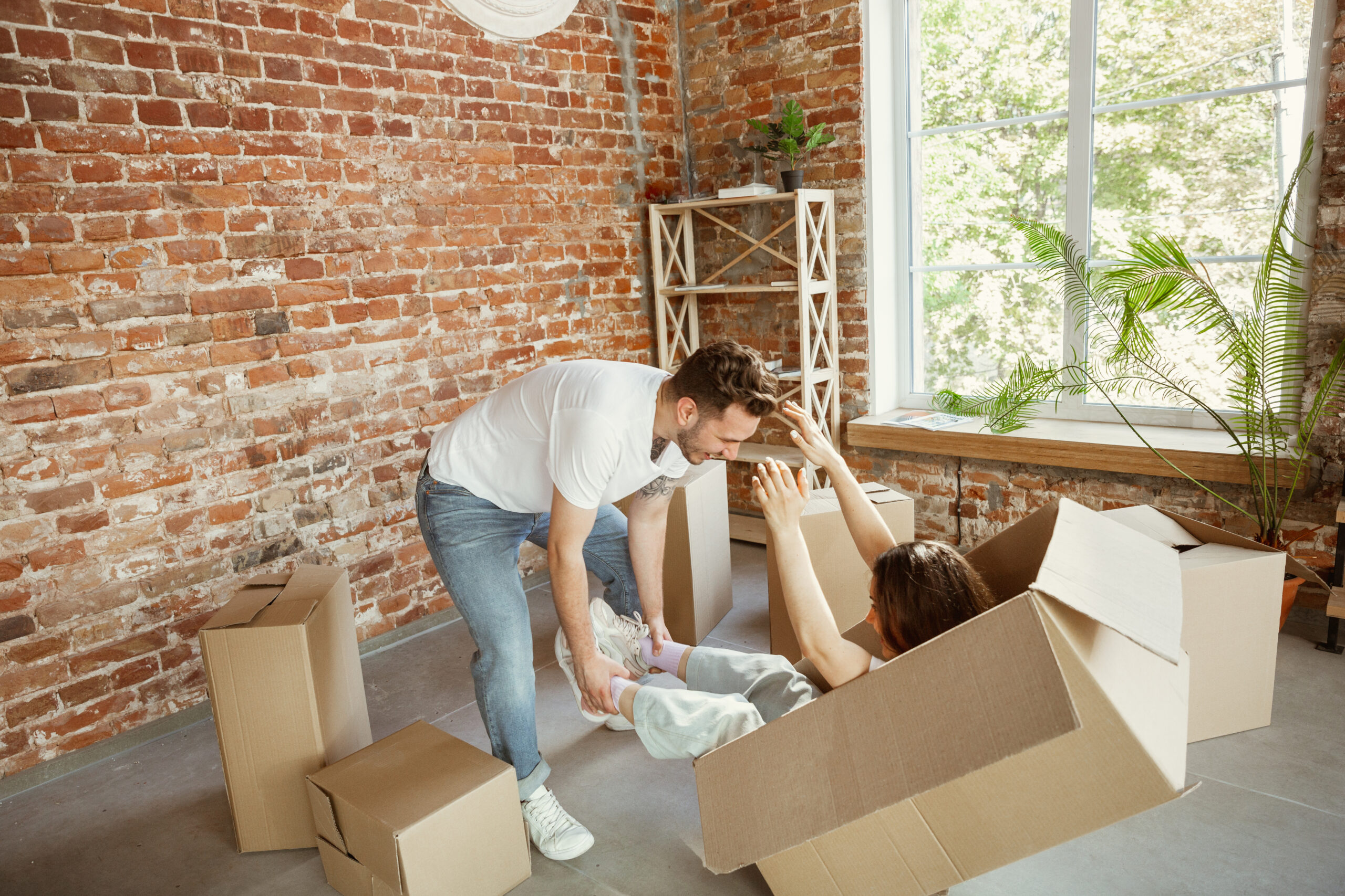 Young couple moved to a new house or apartment