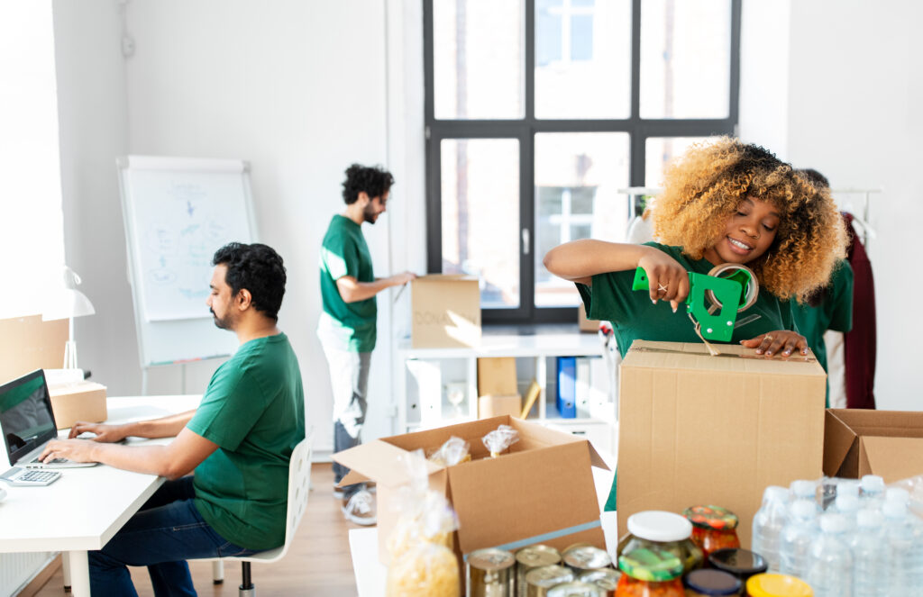 A Professional Movers packing items using biodegradable packing materials and reusable crates.