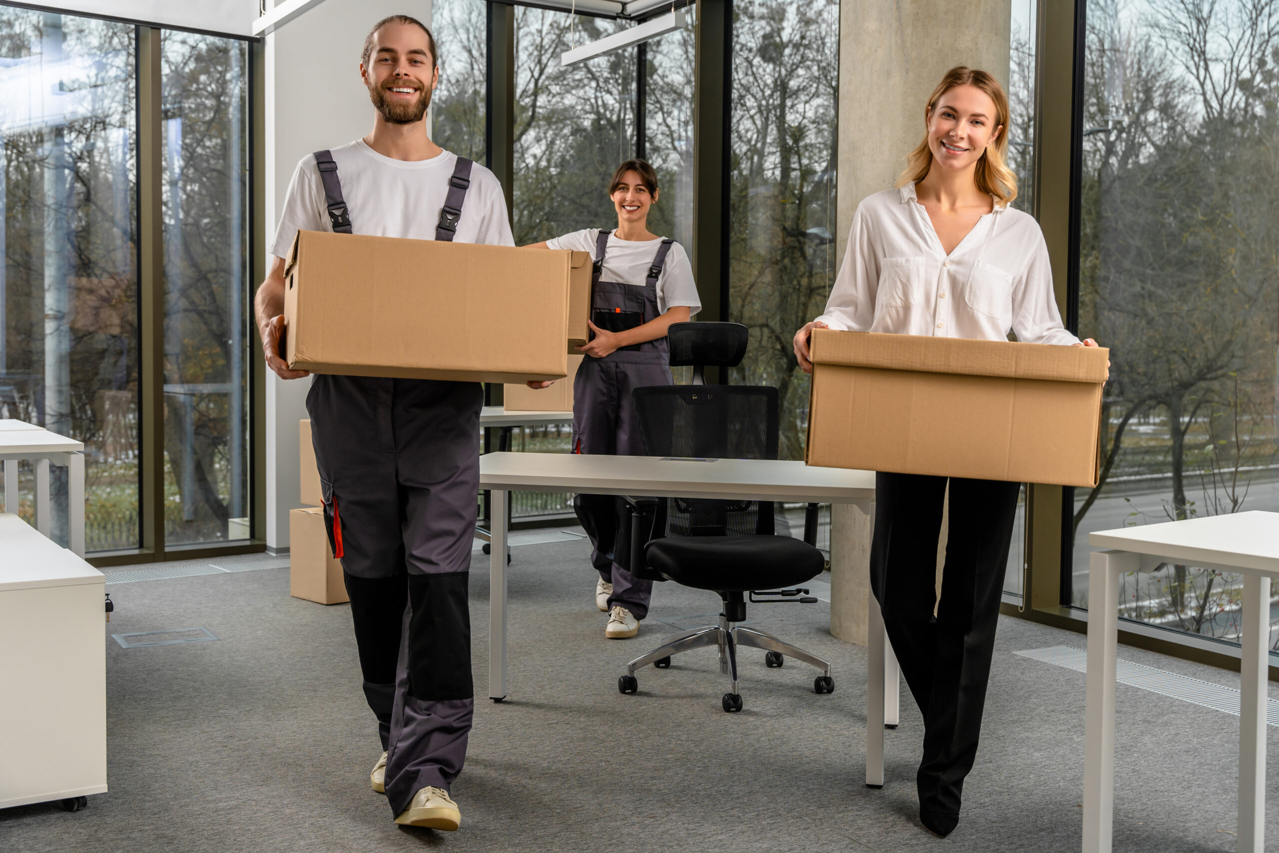 Packaging services. Team of young colleagues working in a packaging office