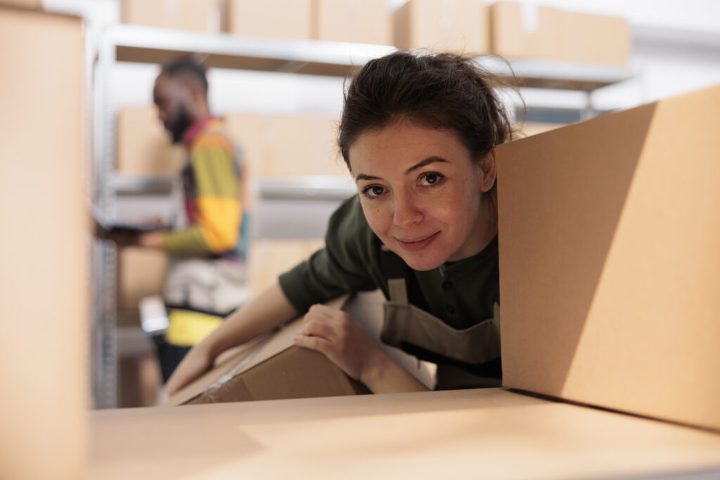 Eco-friendly moving boxes made from recycled materials stacked neatly in a home.