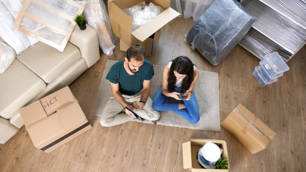 A happy family settling into their new home after using an inexpensive moving company.